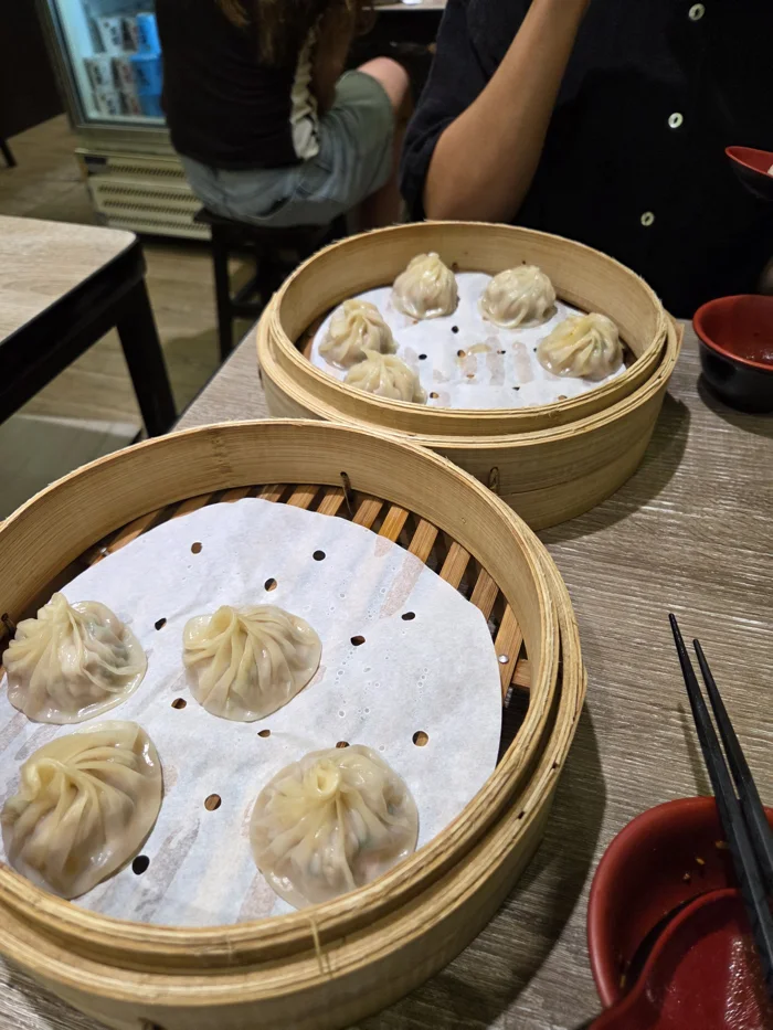 Bamboo steamers with soup dumplings at dinner in Taiwan