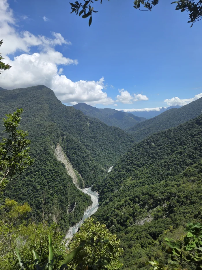 A river winding through steep green mountains in Taiwan