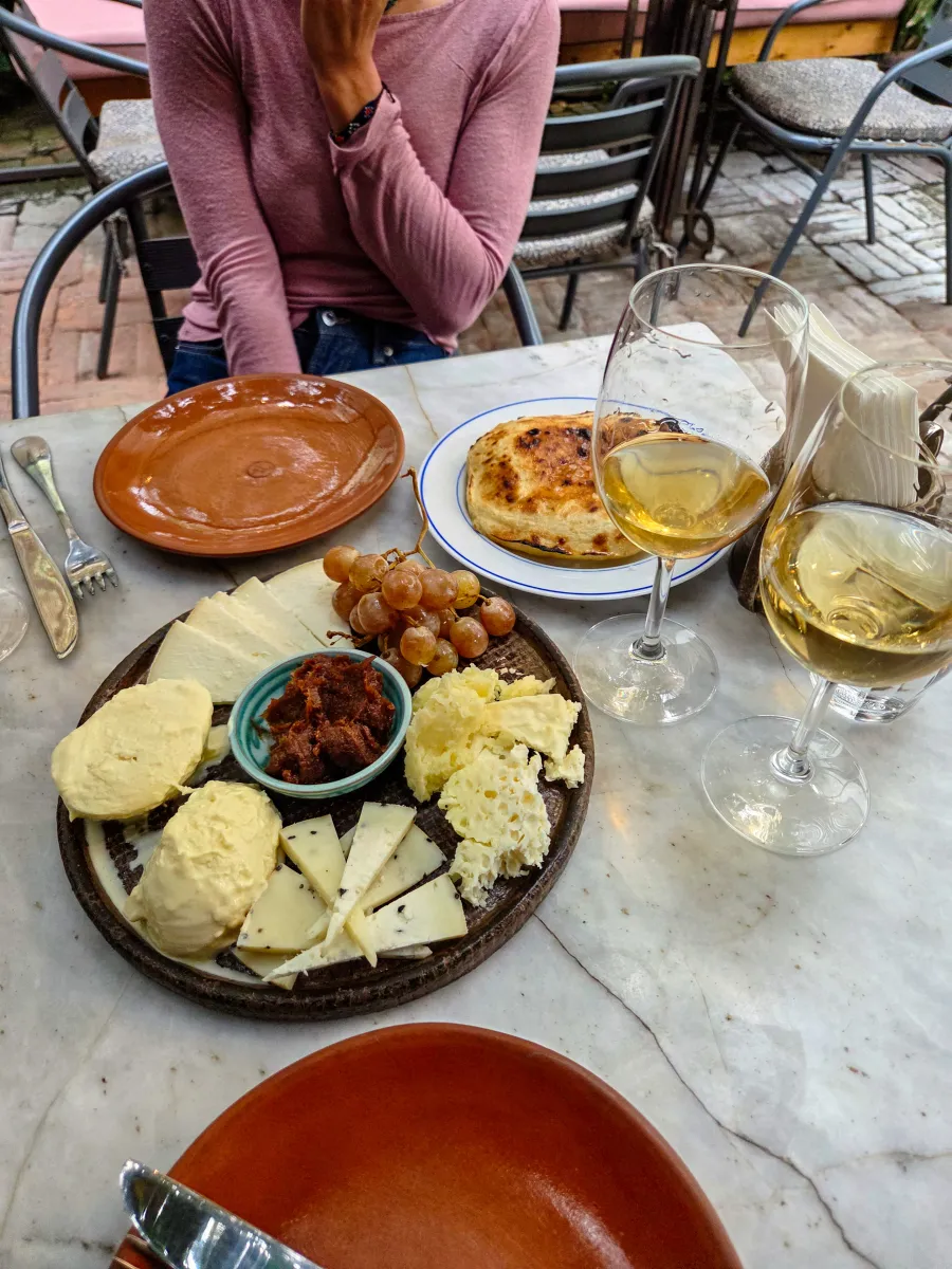 Cheese and wine spread on a marble table