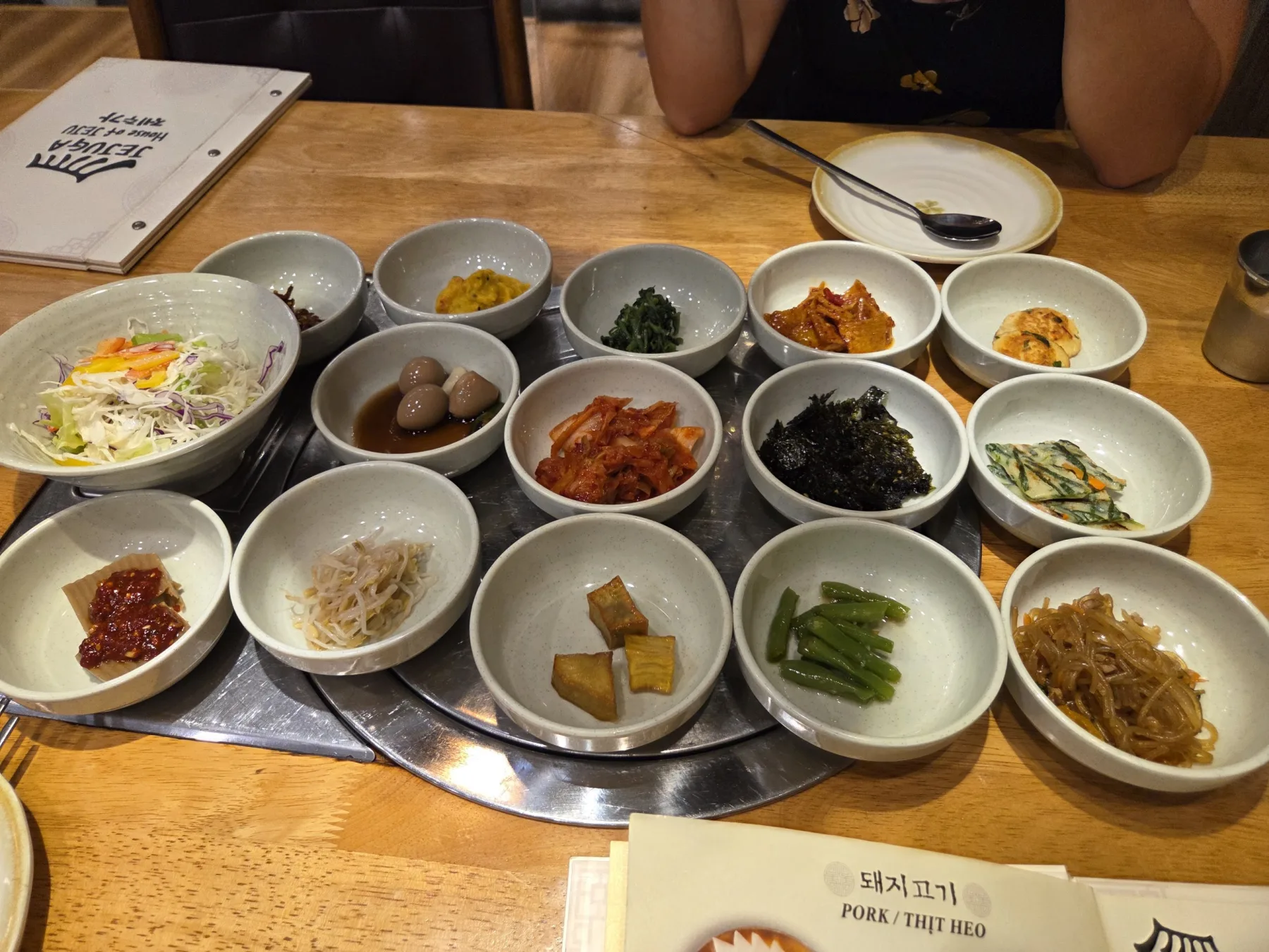 A Korean meal surrounded by small bowls of banchan in Nha Trang